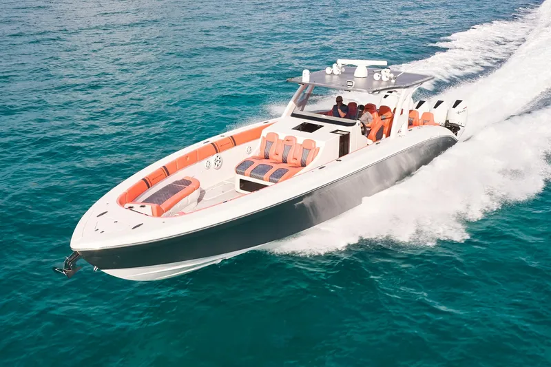 Slide: The Image of Midnight Express 43 Open boat cruising on clear blue water, showcasing sleek design and powerful engines. - 3