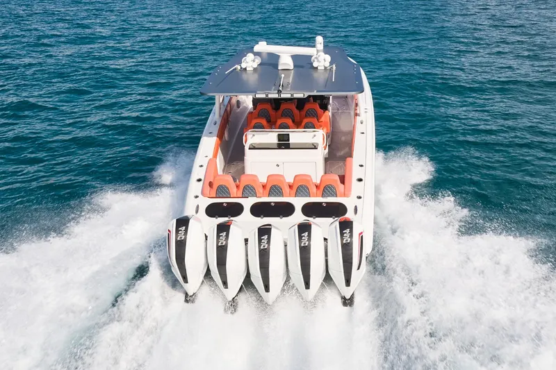 Slide: The Image of Midnight Express 43 Open boat with five powerful engines cruising on open water. - 4