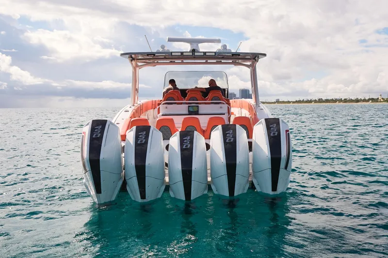 Slide: The Image of Midnight Express 43 Open boat with five powerful outboard engines on open water. - 8