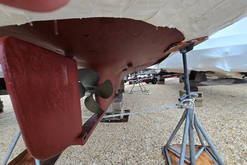 Slide: The Image of Underneath view of a 1982 SISU 26 boat, showing propeller and rudder. - 12