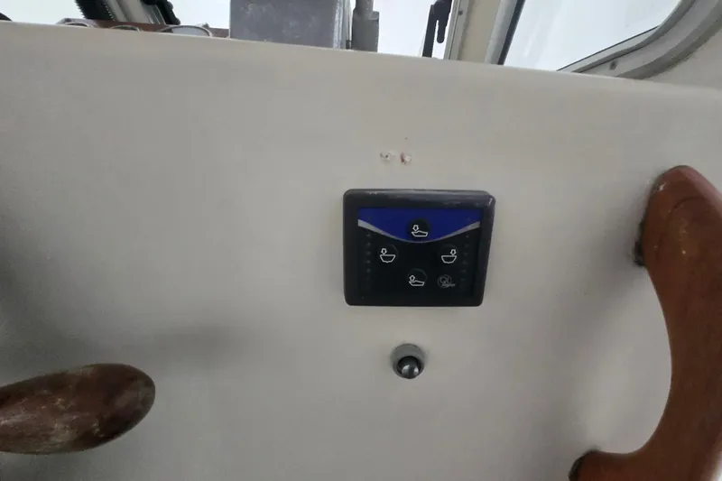 Slide: The Image of Control panel on a 1982 SISU 26 boat dashboard with wooden handle. - 17