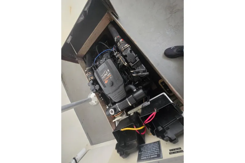 Slide: The Image of Engine compartment of a 1982 SISU 26 boat, showcasing the motor and components. - 25