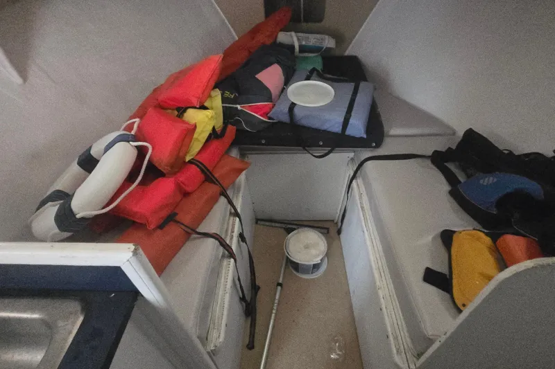 Slide: The Image of Interior of a 1982 SISU 26 boat with life jackets and safety equipment. - 28