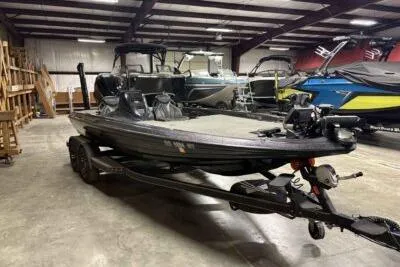 Slide: The Image of 2023 Skeeter ZXR20 boat in showroom, featuring sleek design and modern features. - 2