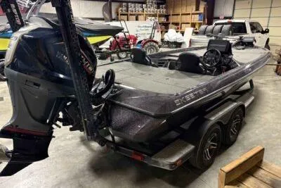 Slide: The Image of 2023 Skeeter ZXR20 boat in a showroom, featuring a sleek design and powerful engine. - 5