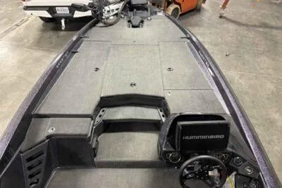 Slide: The Image of 2023 Skeeter ZXR20 boat interior with Humminbird electronics, showcasing spacious deck and steering console. - 6