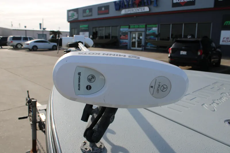 Slide: The Image of Minn Kota i-Pilot system on Mamba 24VX boat, 2024 model, at dealership. - 13