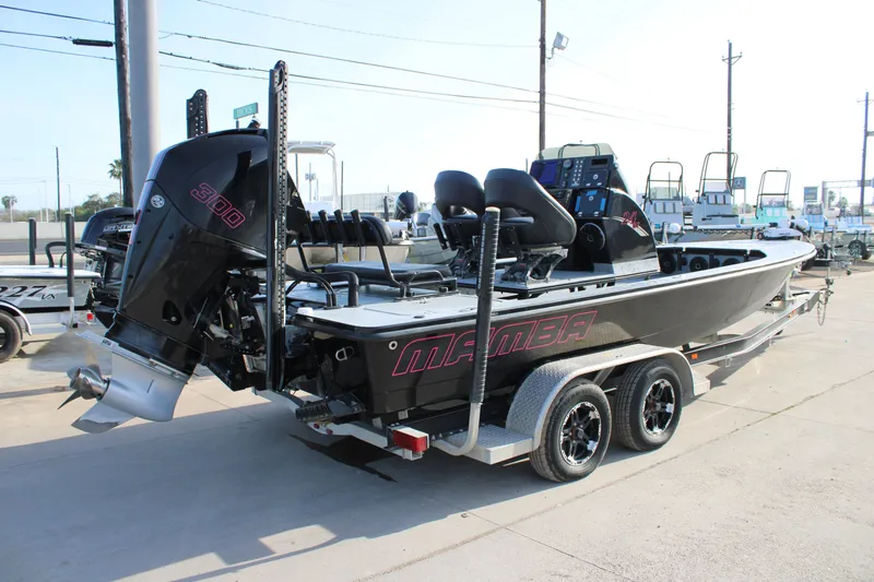 Slide: The Image of 2024 Mamba 24VX boat with powerful 300 engine on a trailer. - 14