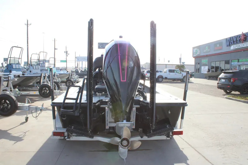 Slide: The Image of 2024 Mamba 24VX boat on trailer at dealership, rear view with outboard motor. - 20