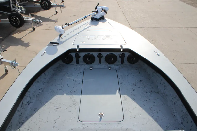 Slide: The Image of 2024 Mamba 24VX boat deck with modern design and equipment. - 6