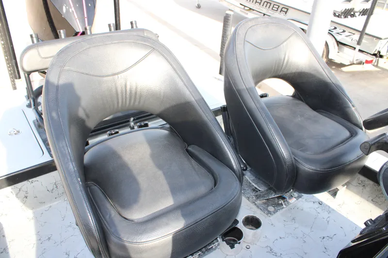 Slide: The Image of Black leather seats in a 2024 Mamba 24VX boat interior. - 9
