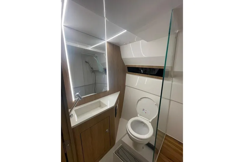Slide: The Image of Luxurious bathroom in 2023 NX Boats NX340, featuring modern fixtures and elegant design. - 12