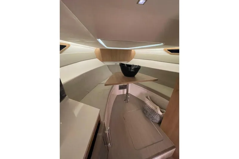 Slide: The Image of Interior of 2023 NX Boats NX340, featuring modern seating and sleek design elements. - 14