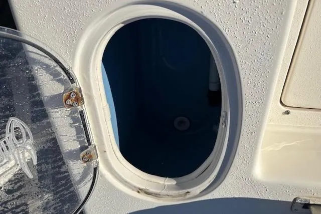 Slide: The Image of Open hatch on 2020 Sea Chaser 22HFC boat, showing interior compartment. - 10