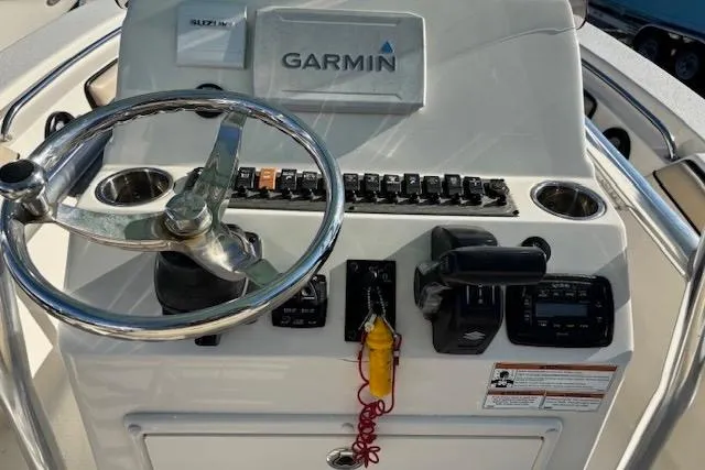 Slide: The Image of 2020 Sea Chaser 22HFC boat console with Garmin navigation system and steering wheel. - 6