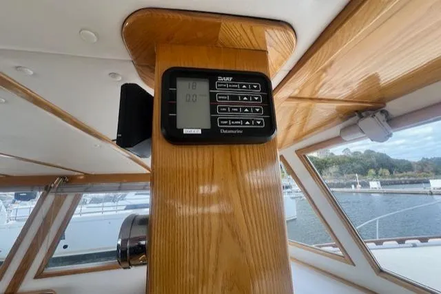 Slide: The Image of Control panel on 1989 Duffy Wilbur 42 Flybridge Cruiser, featuring wood interior and window view. - 11