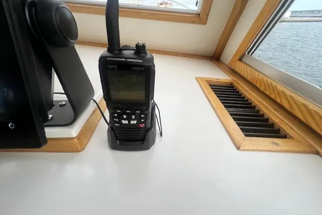 Slide: The Image of Handheld radio on the dashboard of a 1989 Duffy Wilbur 42 Flybridge Cruiser. - 13