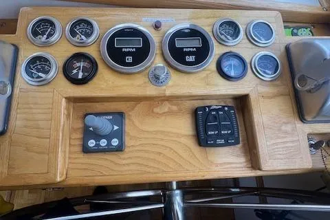 Slide: The Image of Control panel of a 1989 Duffy Wilbur 42 Flybridge Cruiser with gauges and switches. - 16