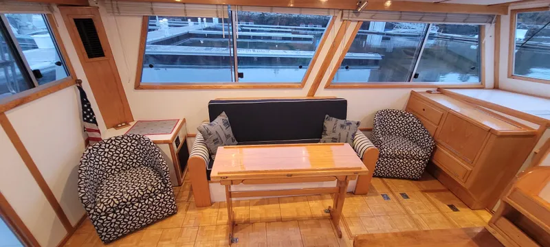 Slide: The Image of Interior of 1989 Duffy Wilbur 42 Flybridge Cruiser with seating and table. - 24
