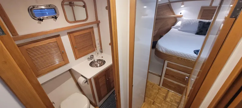 Slide: The Image of Interior of 1989 Duffy Wilbur 42 Flybridge Cruiser with bathroom and cozy bedroom. - 29