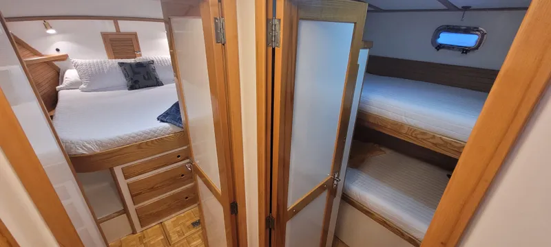 Slide: The Image of 1989 Duffy Wilbur 42 Flybridge Cruiser interior with cozy cabins and wooden finishes. - 30