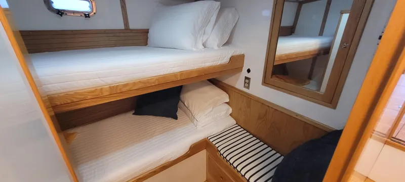 Slide: The Image of Cozy cabin with bunk beds in 1989 Duffy Wilbur 42 Flybridge Cruiser. - 33