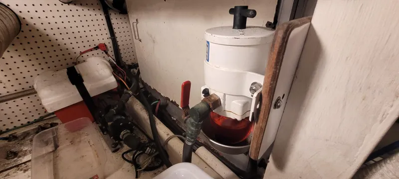 Slide: The Image of Engine room of 1989 Duffy Wilbur 42 Flybridge Cruiser with fuel filter system. - 43