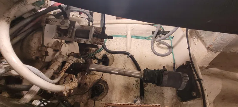 Slide: The Image of Engine compartment of 1989 Duffy Wilbur 42 Flybridge Cruiser, showing mechanical components and wiring. - 46