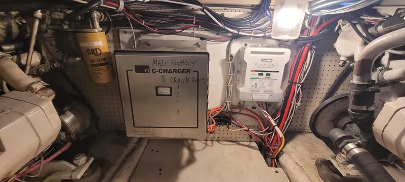 Slide: The Image of Engine room of 1989 Duffy Wilbur 42 Flybridge Cruiser with electrical components and wiring. - 47