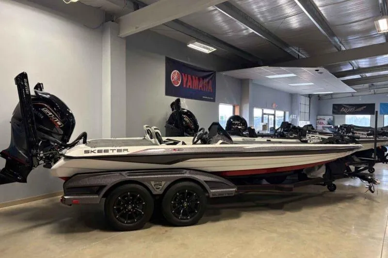 The Image of 2026 Skeeter FXR21 PRO bass boat in showroom with Yamaha engine. - 1