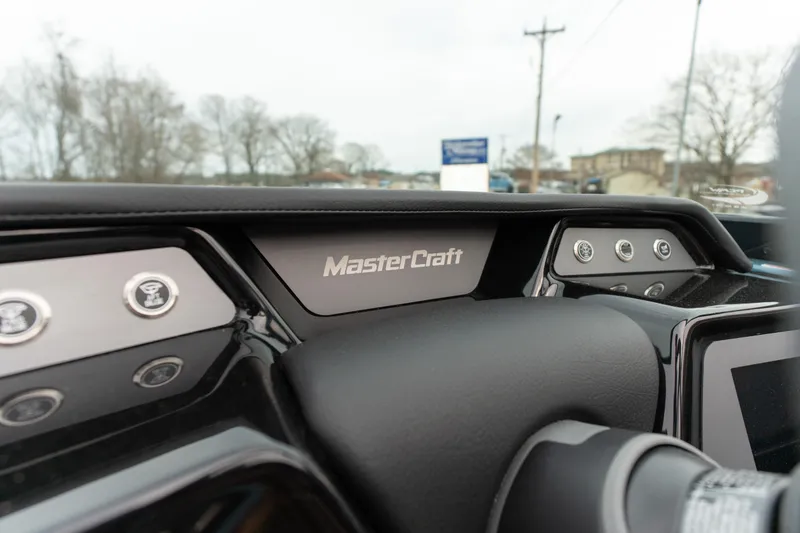 Slide: The Image of 2026 MasterCraft NXT23 dashboard with sleek design and modern controls. - 9