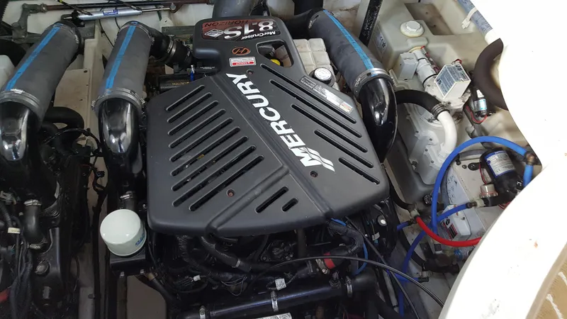 Slide: The Image of Engine compartment of a 2006 Sea Ray 340 Sundancer with Mercury engine. - 14