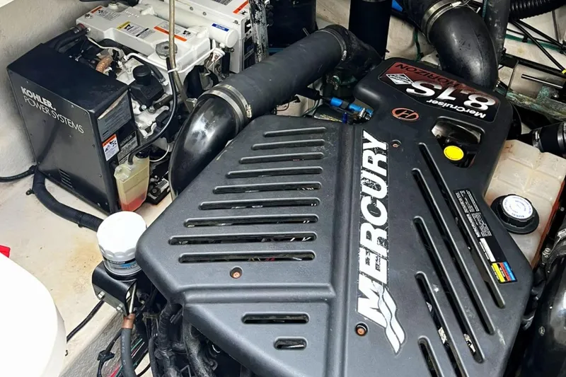 Slide: The Image of Engine compartment of 2006 Sea Ray 340 Sundancer with Mercury and Kohler systems. - 15