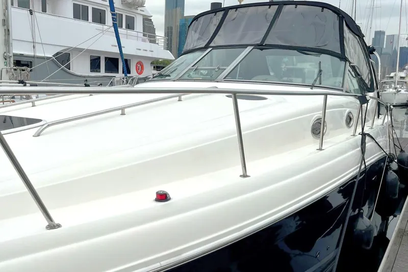 Slide: The Image of 2006 Sea Ray 340 Sundancer yacht docked at marina, featuring sleek design and modern amenities. - 3