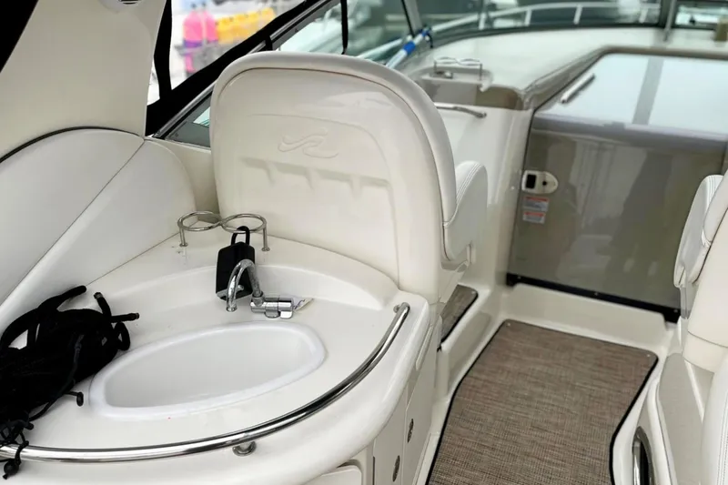 Slide: The Image of 2006 Sea Ray 340 Sundancer interior with sink and seating area. - 6
