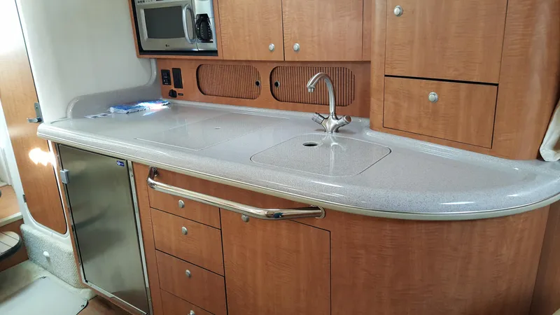 Slide: The Image of Interior of 2006 Sea Ray 340 Sundancer with kitchenette. - 9