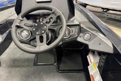 The Image of 2026 Skeeter ZX150 boat dashboard with steering wheel and control panel. - 1