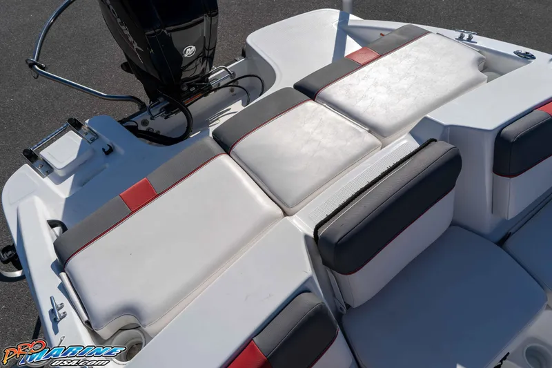 Slide: The Image of 2021 Tahoe T16 boat seating area with white and gray upholstery, featuring red accents. - 15