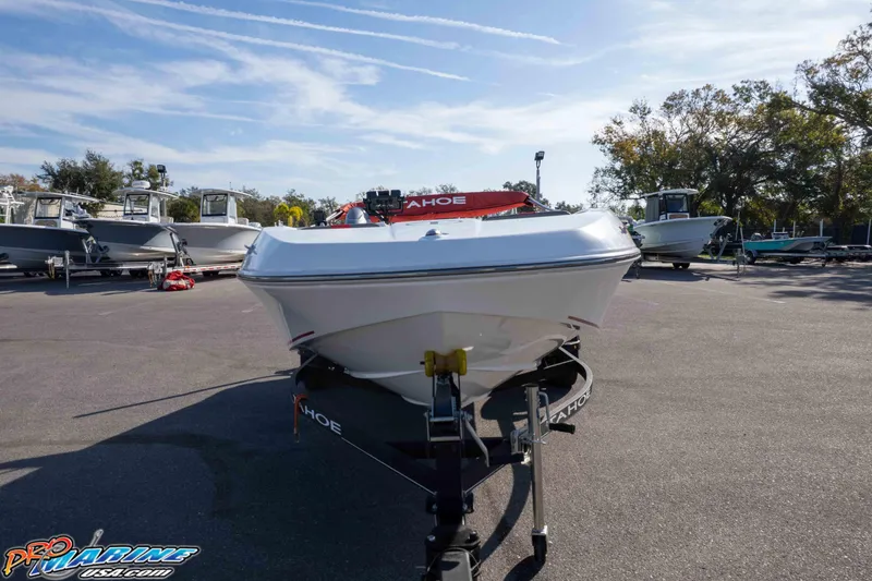 Slide: The Image of 2021 Tahoe T16 boat on trailer in outdoor showroom, clear sky background. - 23