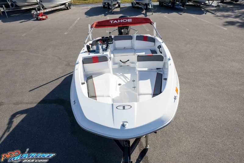 Slide: The Image of 2021 Tahoe T16 boat with red canopy, parked on asphalt, viewed from above. - 24