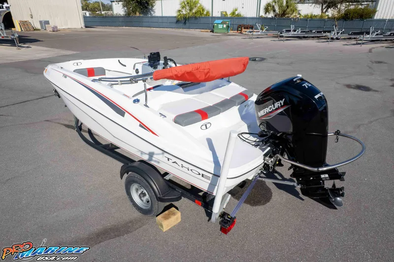 Slide: The Image of 2021 Tahoe T16 boat with Mercury engine on trailer in parking lot. - 32
