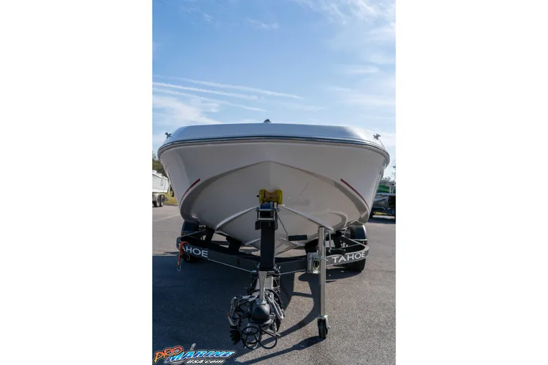 Slide: The Image of 2021 Tahoe T16 boat on trailer under clear blue sky. - 5