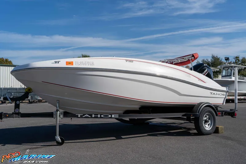 Slide: The Image of 2021 Tahoe T16 boat on trailer under clear blue sky. - 8