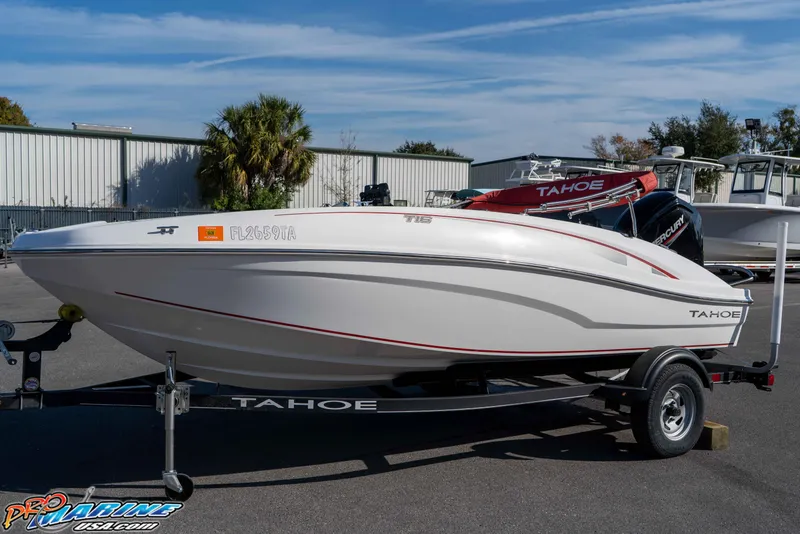 Slide: The Image of 2021 Tahoe T16 boat on trailer in outdoor setting. - 9