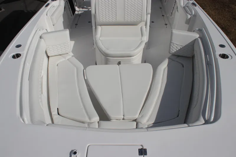 Slide: The Image of 2026 Tidewater 256 LXF boat interior with white cushioned seating and modern design. - 24