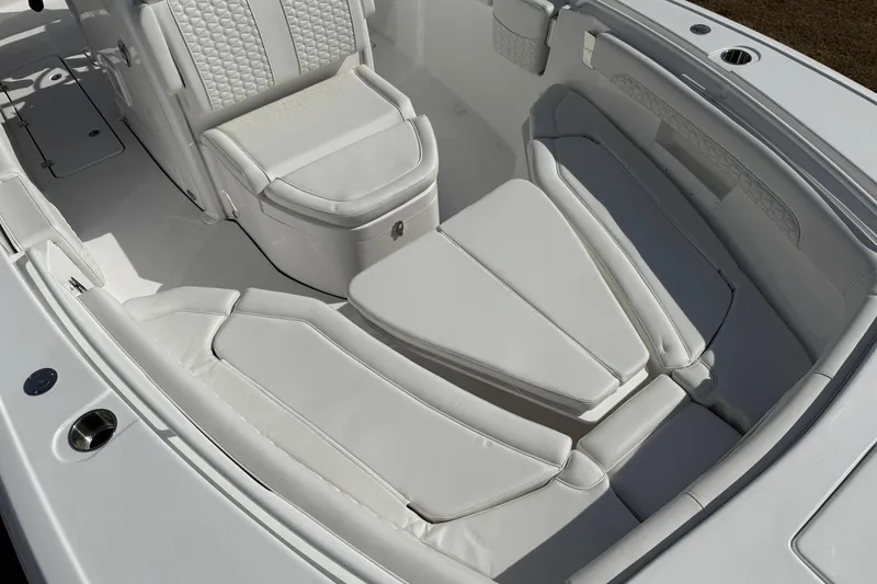 Slide: The Image of 2026 Tidewater 256 LXF boat interior with luxurious white seating and modern design. - 6