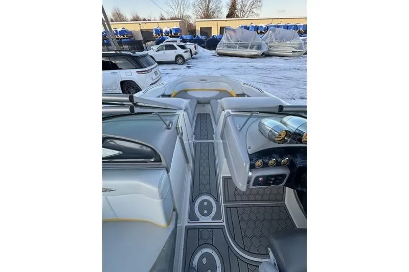 Slide: The Image of 2004 MasterCraft XStar 23 boat interior with sleek design and modern dashboard. - 13