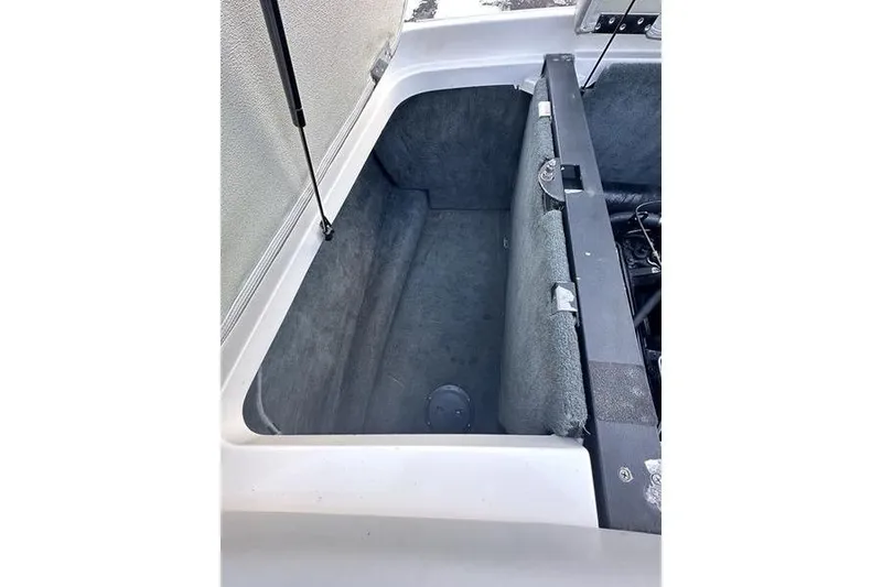 Slide: The Image of Open storage compartment in a 2004 MasterCraft XStar 23 boat. - 20