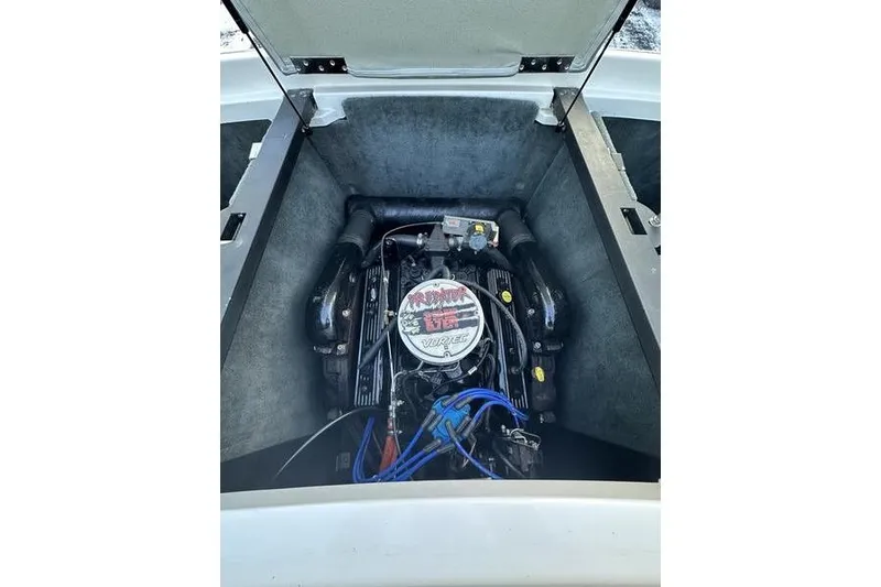 Slide: The Image of 2004 MasterCraft XStar 23 engine compartment showcasing powerful marine engine. - 22