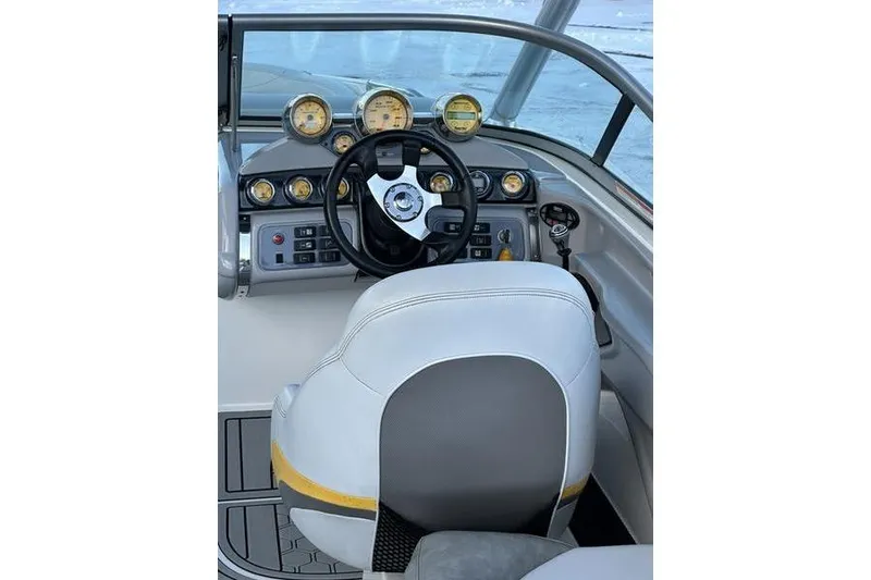 Slide: The Image of 2004 MasterCraft XStar 23 boat dashboard with steering wheel and gauges. - 8